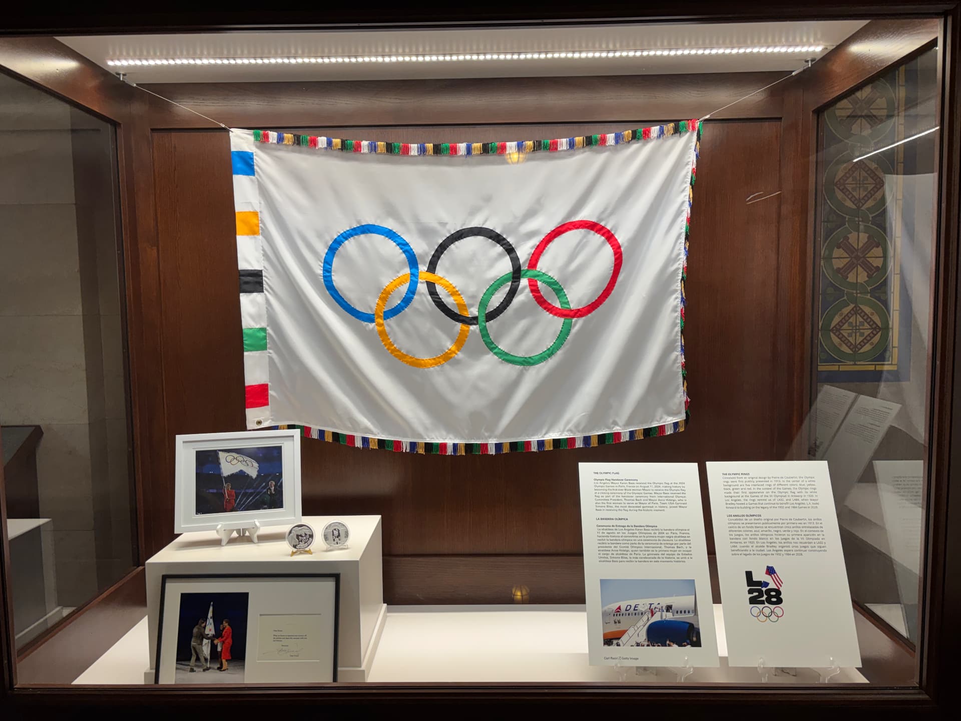The Olympic flag displayed in a case at Los Angeles City Hall