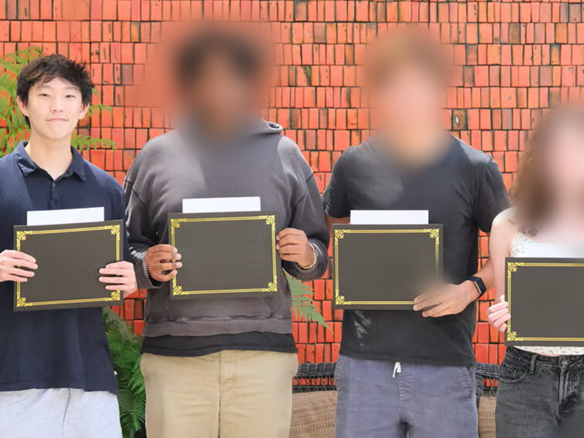 Research prize recipients holding award plaques